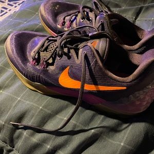 Kobe Bryant’s purple and orange size 10.5